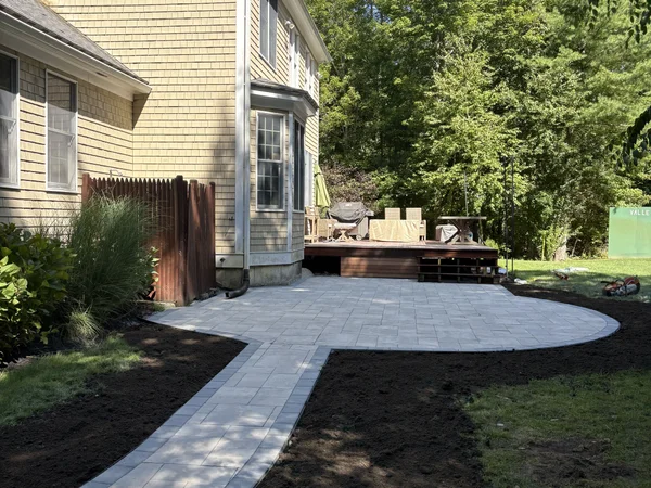 Curved Patio & Walkway - MAC Excavation & Landscape Curved paver patio with connecting walkway to deck by MAC Excavation & Landscape in South Shore MA