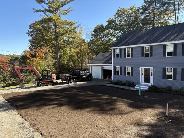 Patio Site Preparation - MAC Excavation & Landscape Excavation equipment preparing residential property for patio installation by MAC Excavation & Landscape in South Shore MA